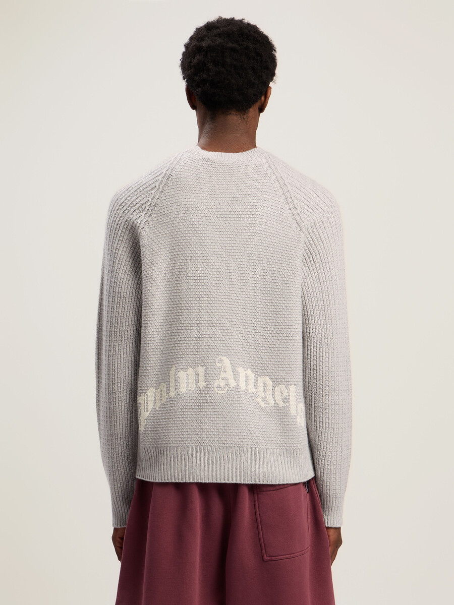 maglione a coste con logo curvo